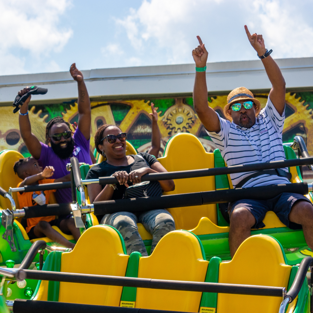 Untitled Design (1) People on a ride at Jolly Roger Amusement Park